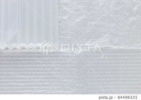 Variety of bubble wrap foil for packaging. Closeup, texture background, plastic pollution concept Variety of bubble wrap foil for packaging. Closeup, texture background, plastic pollution concept 84496335