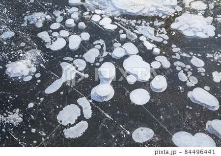 Winter ice with gas bubbles trapped inside 84496441