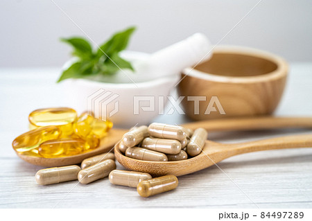 Alternative medicine herbal organic capsule with vitamin E omega 3 fish oil, mineral, drug with herbs leaf natural supplements for healthy good life. 84497289