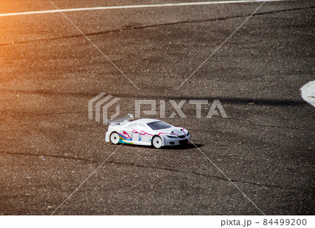 car sport, radio-controlled car moving along the asphalt road, car sport competition 84499200