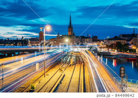 Stockholm, Sweden. Scenic View Of Stockholm Skyline At Summer Evening. Famous Popular Destination Scenic Place. Riddarholm Church And Subway Railway Stockholm, Sweden. Scenic View Of Stockholm Skyline At Summer Evening. Famous Popular Destination Scenic Place. Riddarholm Church And Subway Railway 84499642