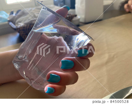 Female hand with stylish colorful nails 84500528