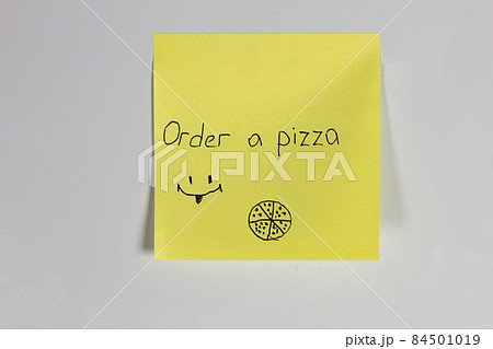 Yellow sticker on the door of the refrigerator with the inscription Pizza Yellow sticker on the door of the refrigerator with the inscription Pizza 84501019