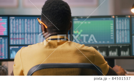 African American broker analyzing charts African American broker analyzing charts 84501537