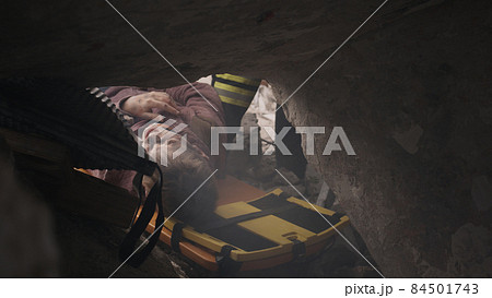 Teenager being saved from debris 84501743