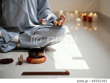 front view woman meditating with incense candles. High quality photo front view woman meditating with incense candles. High quality photo 84502363