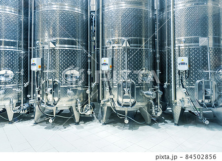 Steel vats for fermenting grapes, modern winery interior. 84502856