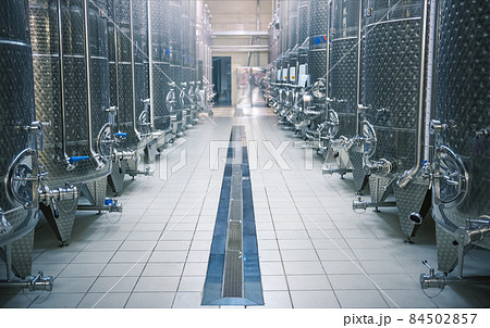 Steel wine fermentation vats in winery, selective focus 84502857