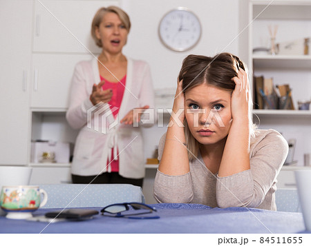 Mother scolds her adult daughter 84511655