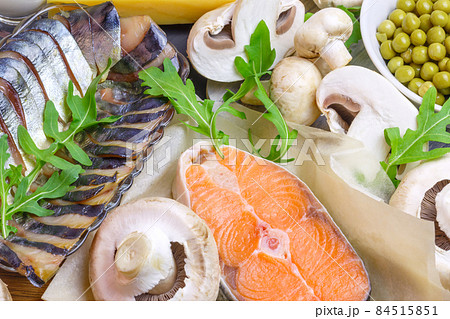 Healthy food, foods rich in vitamin D, omega 3 and protein, salmon fish, smoked mackerel, fresh champignons, green peas. Keto diet 84515851