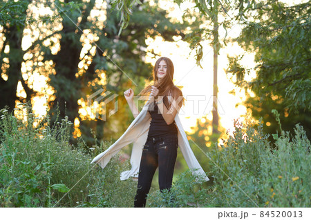 young girl on nature shows emotions 84520013