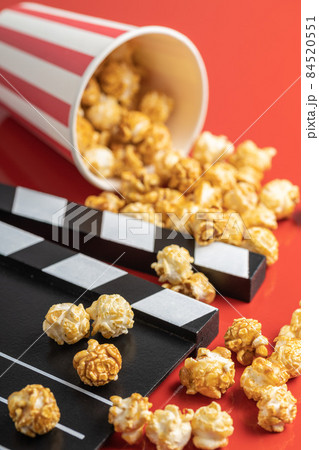 Sweet caramel popcorn and clapper board 84520551