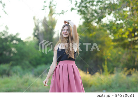 Young beautiful girl shows emotions delight pleasure bliss 84520631