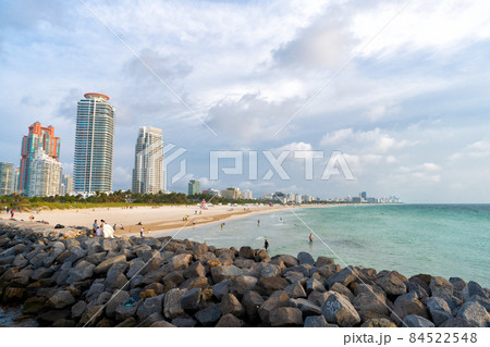 Miami, USA - April 19, 2021: sea beach and cityscape. Beach resort on urban skyline 84522548