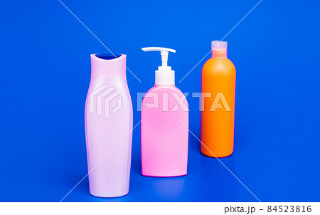 Toiletry and cosmetic plastic containers for liquid shower and bath products packing in row, bottles 84523816