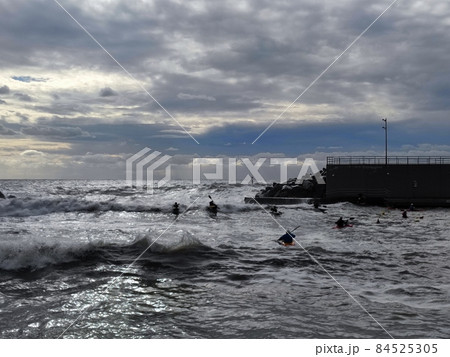 Kayaks in big waves in Genoa Nervi harbor Kayaks in big waves in Genoa Nervi harbor 84525305