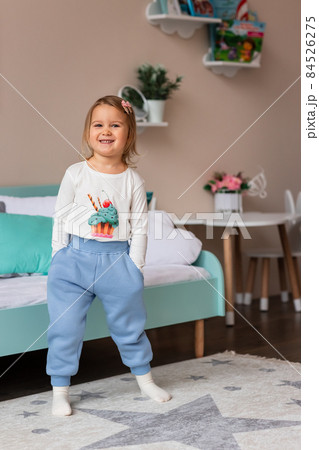 Cute little girl posing in a costume in her room Cute little girl posing in a costume in her room 84526275