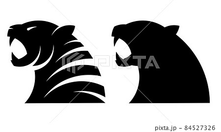 Silhouettes of head of roaring angry tiger with open mouth and sharp teeth. Symbol, emblem of new year 2022. Simple black and white vector isolated on white background Silhouettes of head of roaring angry tiger with open mouth and sharp teeth. Symbol, emblem of new year 2022. Simple black and white vector isolated on white background 84527326