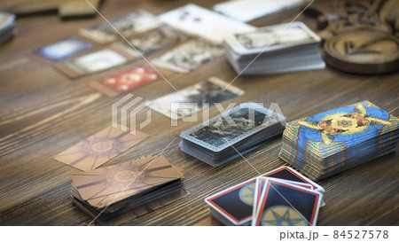 Tarot card reader arranges cards in a card spread. Fortune-telling concept Tarot card reader arranges cards in a card spread. Fortune-telling concept 84527578