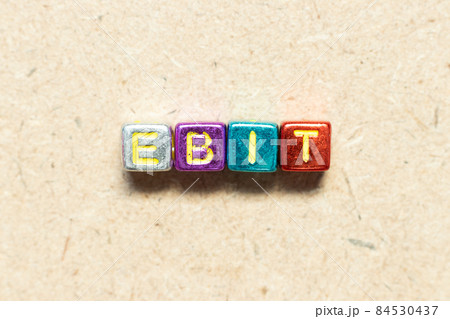 Metallic color alphabet letter block in word EBIT (Abbreviation of Earnings Before Interest and Taxes) on wood background Metallic color alphabet letter block in word EBIT (Abbreviation of Earnings Before Interest and Taxes) on wood background 84530437