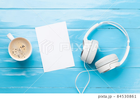 Headphones, coffee cup and blank paper 84530861