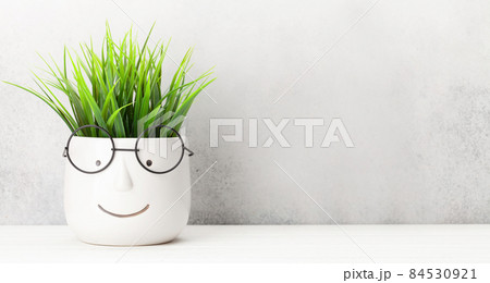 Table with plant in pot with glasses Table with plant in pot with glasses 84530921
