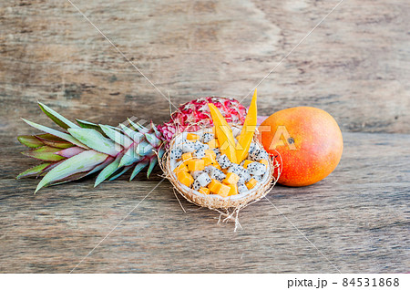 Fruit salad with dragon fruit and papaya in half a coconut Fruit salad with dragon fruit and papaya in half a coconut 84531868