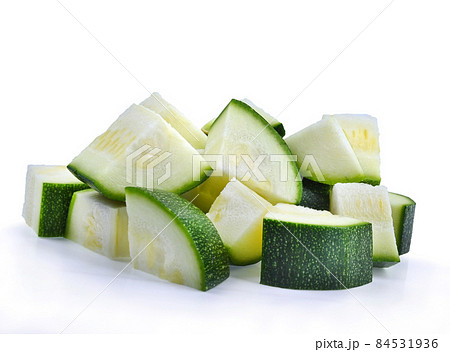fresh green zucchini or slices isolated on white background. fresh green zucchini or slices isolated on white background. 84531936