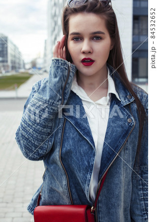 young pretty brunette business woman posing emotional against modern building in glasses holding coffee, lifestyle people concept young pretty brunette business woman posing emotional against modern building in glasses holding coffee, lifestyle people concept 84532652