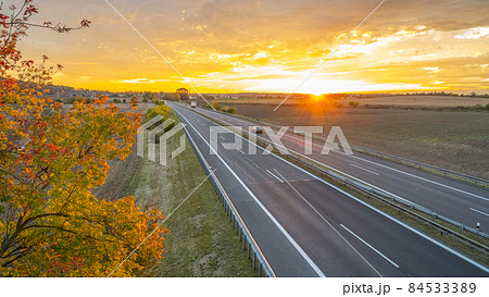 Highway at sunset in autumn evening 84533389