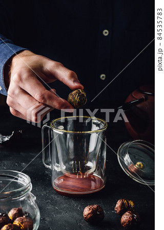 Steeping tea in glass mug 84535783