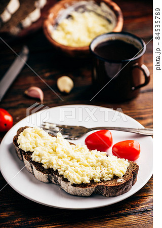Rye bread toast with processed cheese and garlic Rye bread toast with processed cheese and garlic 84535789