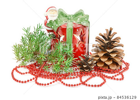 New Year's decor: beads, cones, candlestick isolated on a white . New Year's decor: beads, cones, candlestick isolated on a white . 84536129