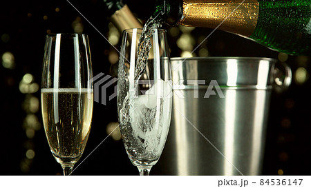 Champagne theme with bottle and glasses. 84536147