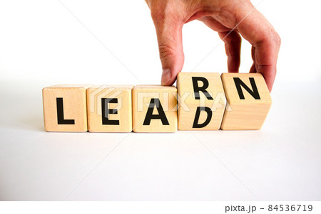 Learn and lead symbol. Businessman turns wooden cubes, changes the word 'learn' to 'lead'. Beautiful white table, white background. Business, educational, learn and lead concept. Copy space. Learn and lead symbol. Businessman turns wooden cubes, changes the word 'learn' to 'lead'. Beautiful white table, white background. Business, educational, learn and lead concept. Copy space. 84536719