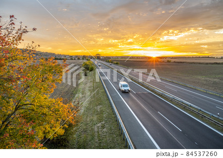 Highway at sunset in autumn evening 84537260