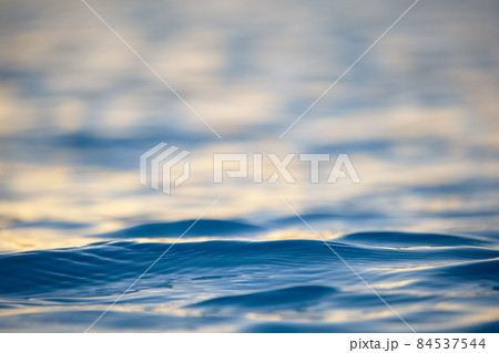 Closeup seascape surface of blue sea water with small ripple waves. 84537544