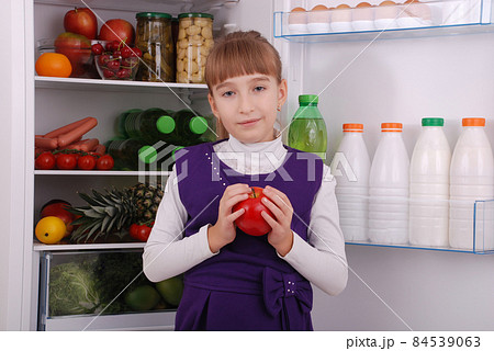 Beautiful  girl near the Fridge with healthy food. 84539063