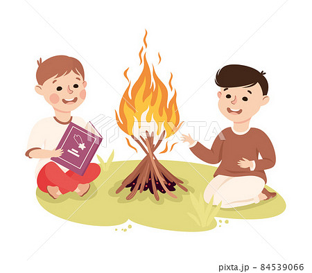Little Boy Sitting Near Campfire And Reading のイラスト素材