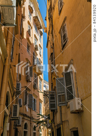 Old narrow street, old buildings on Corfu island, Greece. Old narrow street, old buildings on Corfu island, Greece. 84539920