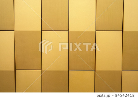 Yellow metallic facade of the building. Abstract texture background Yellow metallic facade of the building. Abstract texture background 84542418