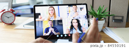 Woman communicating with colleagues via conference call on digital tablet 84550191