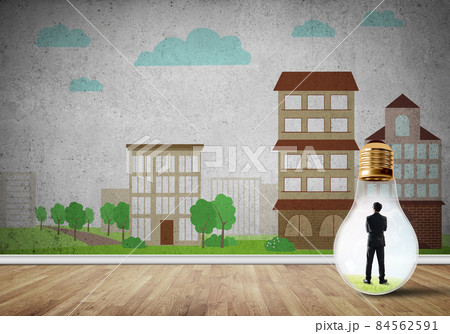 Businessman trapped in bulb Businessman trapped in bulb 84562591