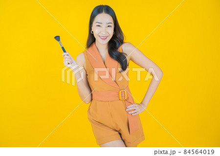 Portrait beautiful young asian woman with make up brush cosmetic 84564019