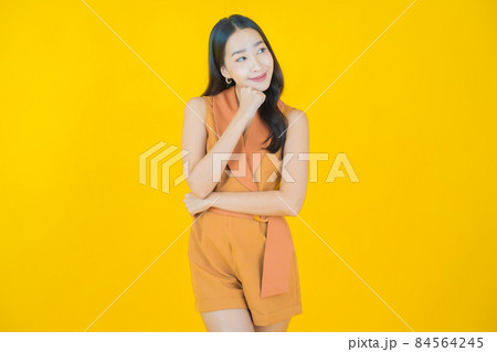 Portrait beautiful young asian woman smile with action Portrait beautiful young asian woman smile with action 84564245