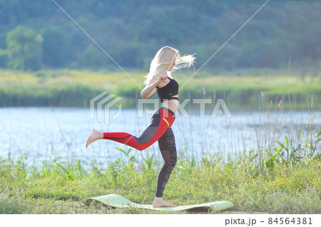 Young beautiful woman squats shows result press on stomach workout training wearing top 84564381