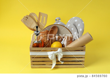 Concept of gift with Christmas basket on yellow background 84569760