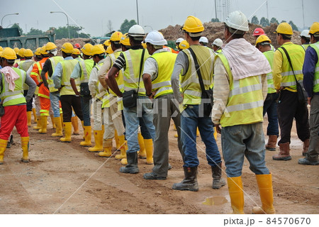 SELANGOR, MALAYSIA -FEBRUARY 13, 2015: Group of construction workers assemble at the open space in the construction site.  84570670
