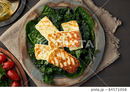 Cyprus fried halloumi cheese with healthy green salad. Lchf, pegan, fodmap, paleo, scd, keto diet. 84571008