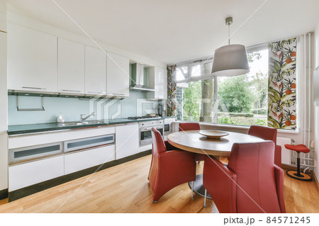 Beautiful kitchen combined with a dining room for four Beautiful kitchen combined with a dining room for four 84571245